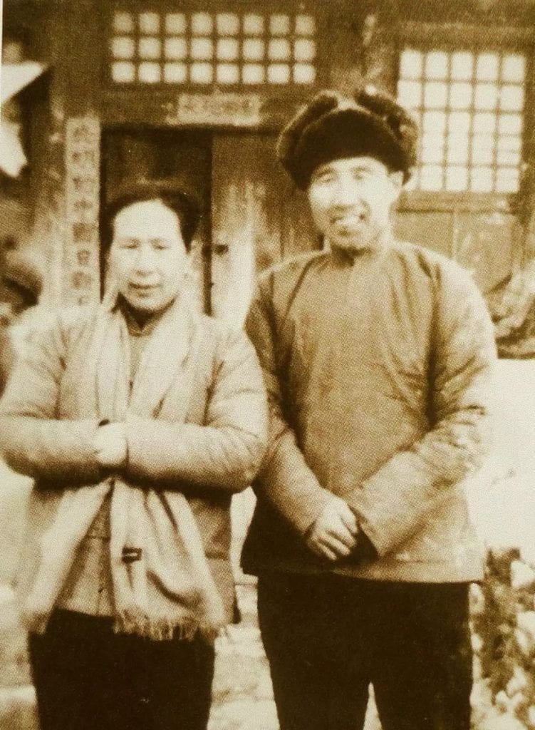 photograph of a man and woman standing beside one another