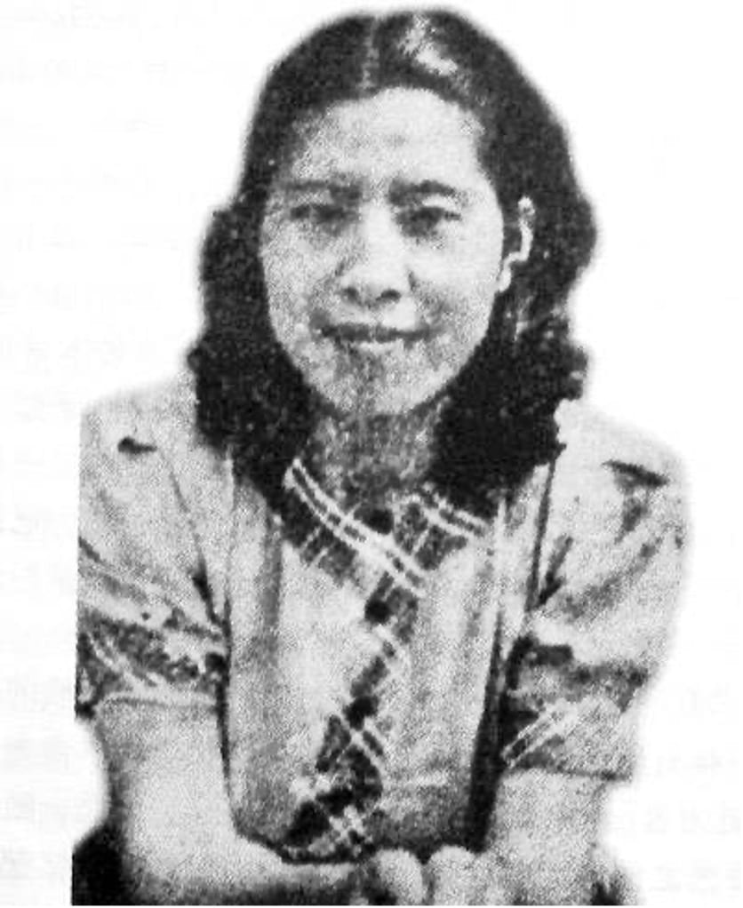 black and white image of a young woman smiling