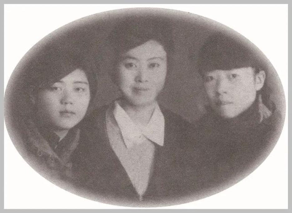black and white photograph of Xiao Hong, Guan Dawei, and Bai Land standing beside one another