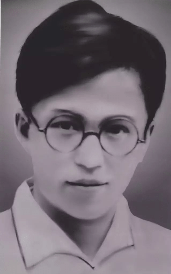 black and white photograph of a young Yang Cideng wearing round glasses