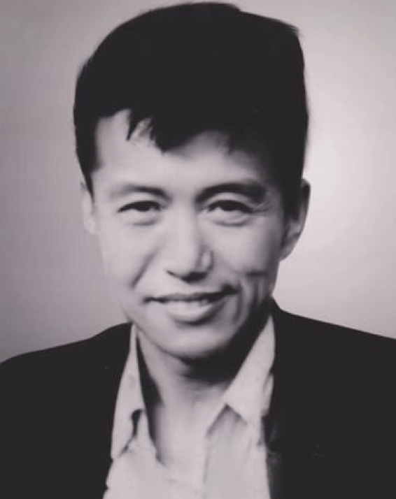 black and white photograph of a middle aged Yang Cideng smiling