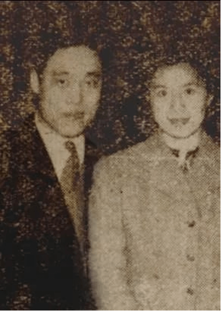 photograph of a man and woman smiling together