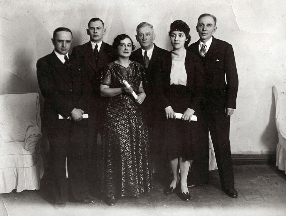 black and white image of six men and women in formal dress