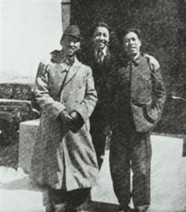 black and white image of three men smiling together